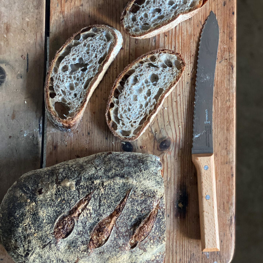 Opinel bread knife being used