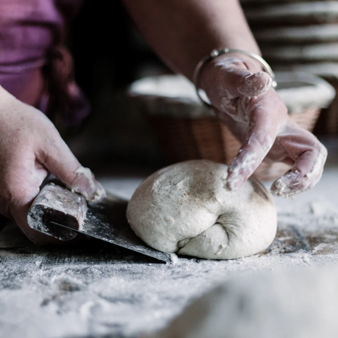 Shaping a sourdough boule