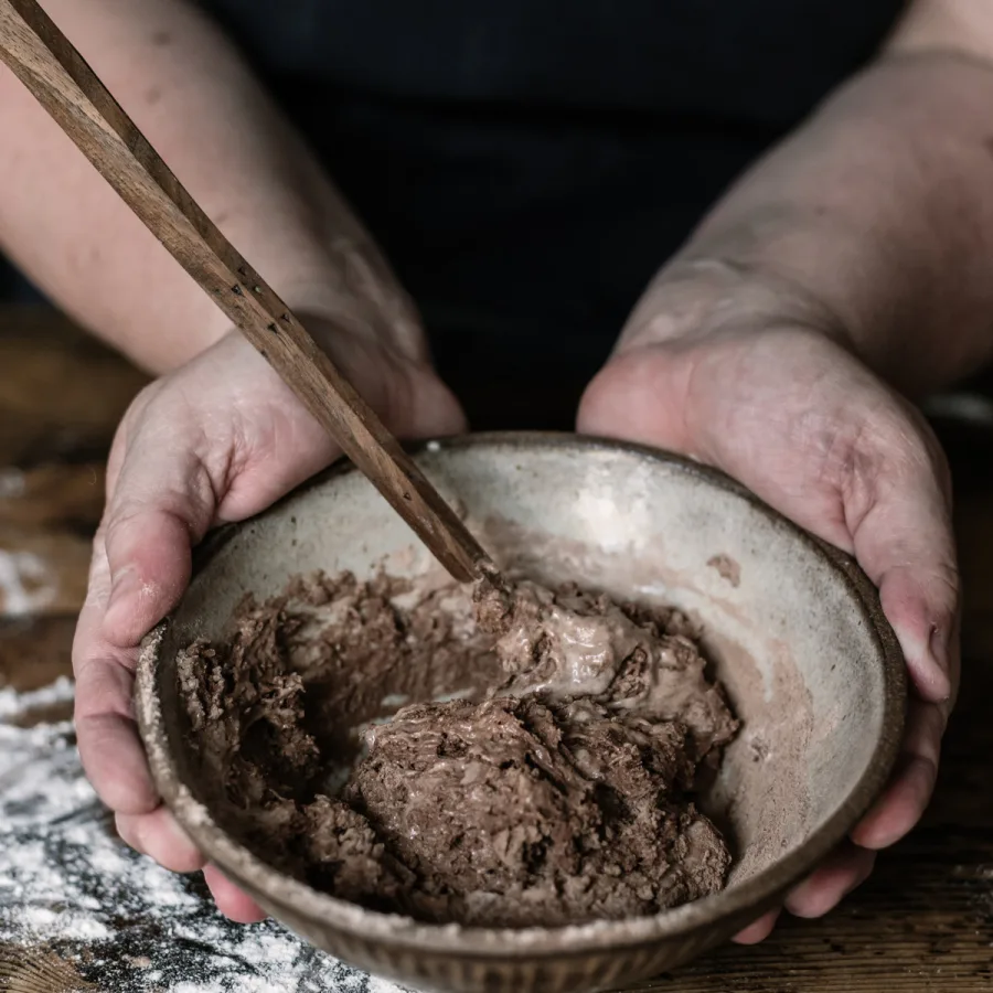 Wooden sourdough spurtle with a starter