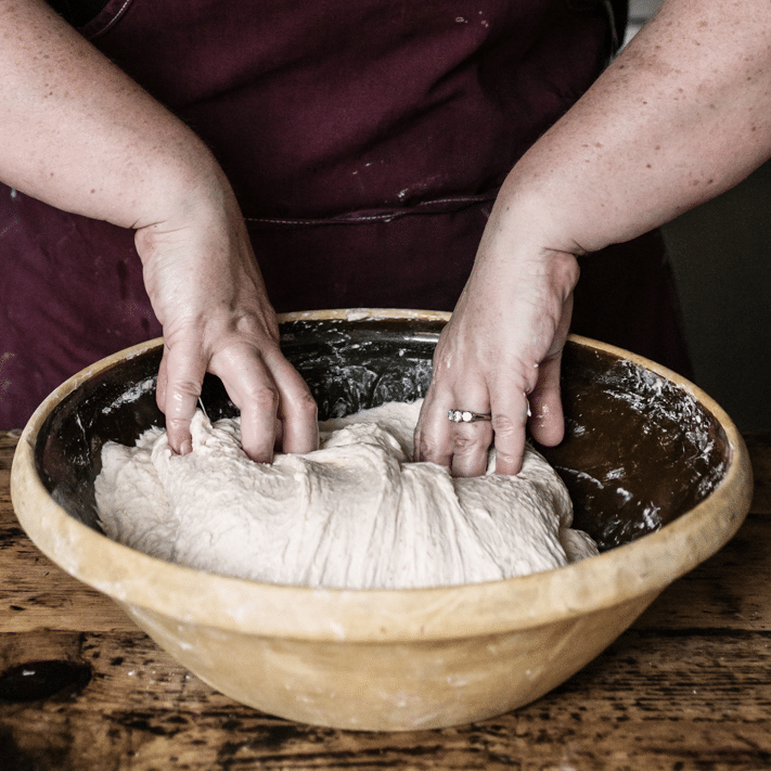 Completing 1 sourdough stretch and fold.